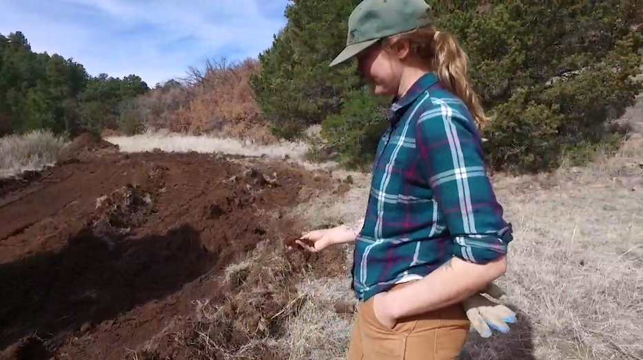 Megan Larsen samples the soil